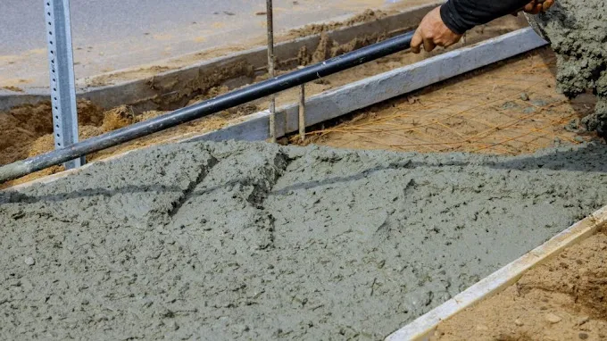 Concrete polishers finishing a polished concrete floor